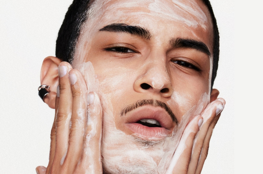 Closeup of model applying our iconic Velvet Teddy Matte Lipstick