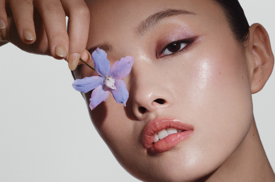 Closeup of model applying our iconic Velvet Teddy Matte Lipstick