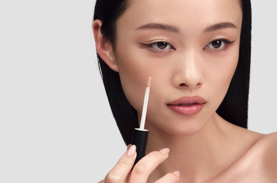 Closeup of model applying our iconic Velvet Teddy Matte Lipstick